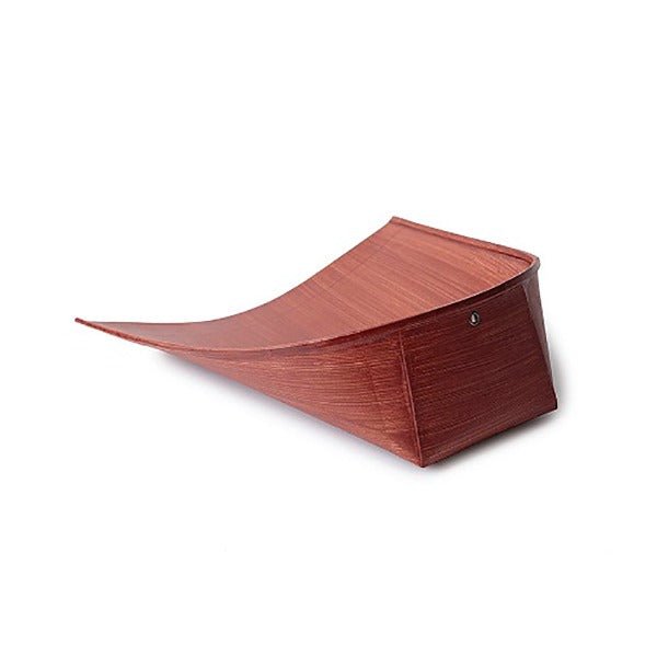 Side angle of a Japanese Harimi dustpan made from hand-shaped washi paper with persimmon tannin finish, featuring a lightweight, curved form for efficient sweeping