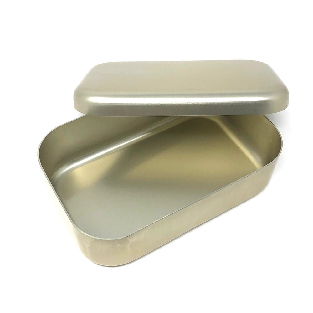 Open matte gold bento lunch box with lid slightly ajar, revealing the smooth, seamless aluminum interior.