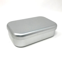 Closed silver aluminum bento lunch box with smooth rounded edges, showcasing a modern, minimalist Japanese design.