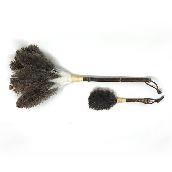 Side-by-side image of a full-size and mini Tokyo feather duster with dark brown ostrich feathers and bamboo handles on a white background