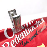 Close-up of a Japanese aluminum peg used as a chip bag clip, demonstrating its strong grip and versatility for everyday household use