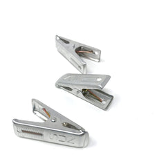 Set of three durable Japanese aluminum clothes pegs with spring-loaded design, ideal for hanging laundry or securing fabric in place