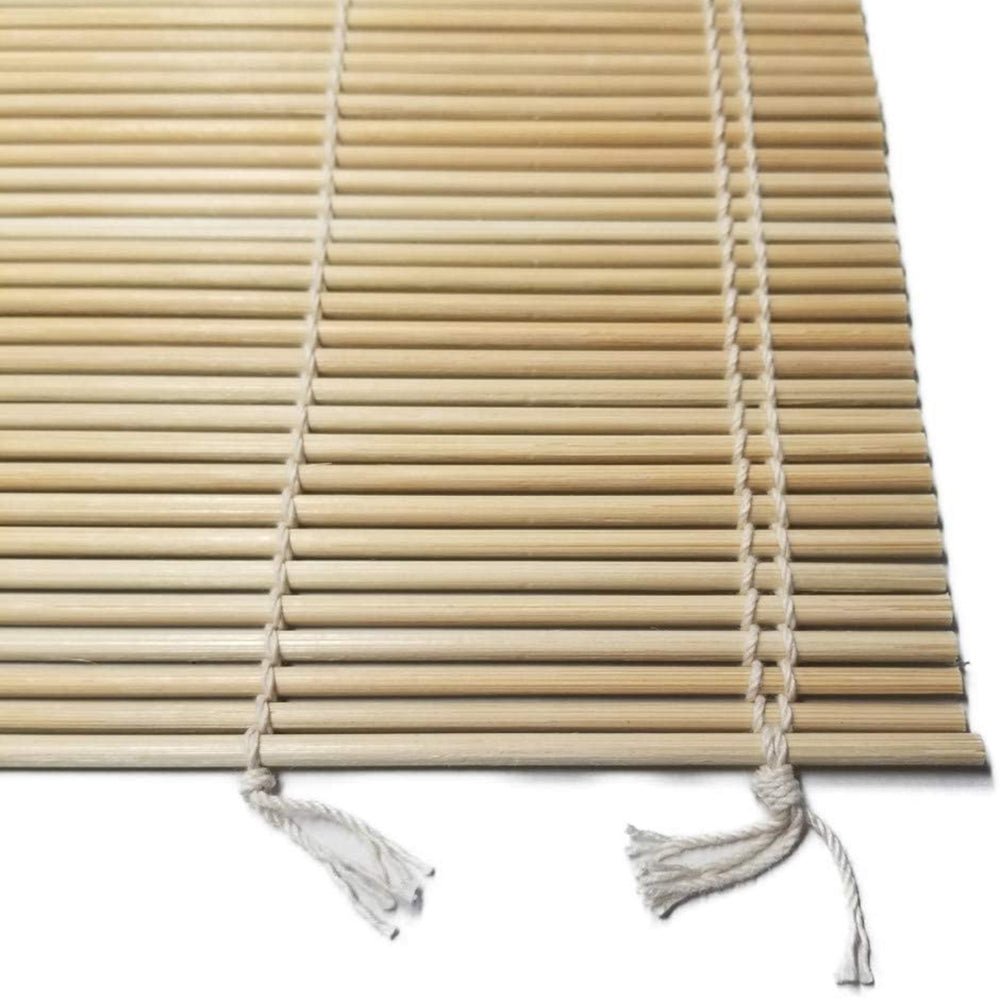 Close-up view of Kikusui bamboo sushi rolling mat showing natural bamboo slats and hand-tied cotton strings used in traditional Japanese sushi-making