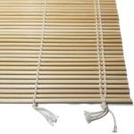 Close-up view of Kikusui bamboo sushi rolling mat showing natural bamboo slats and hand-tied cotton strings used in traditional Japanese sushi-making