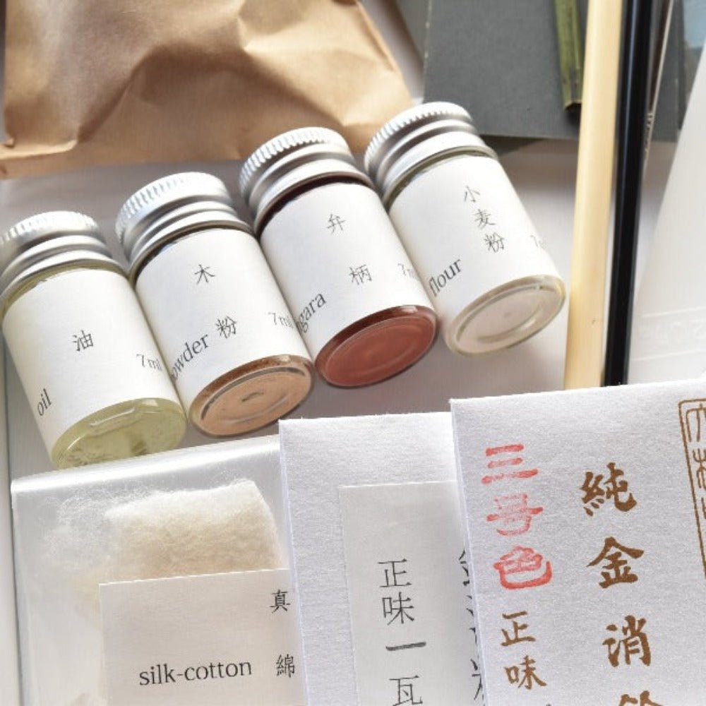 Close-up of Japanese Kintsugi Kit components, including urushi lacquer, pigments, flour, and silk cotton—authentic materials for traditional pottery repair.
