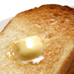 Perfectly sliced butter melting on freshly toasted bread—smooth texture and even portioning achieved with the Japanese butter slicer.