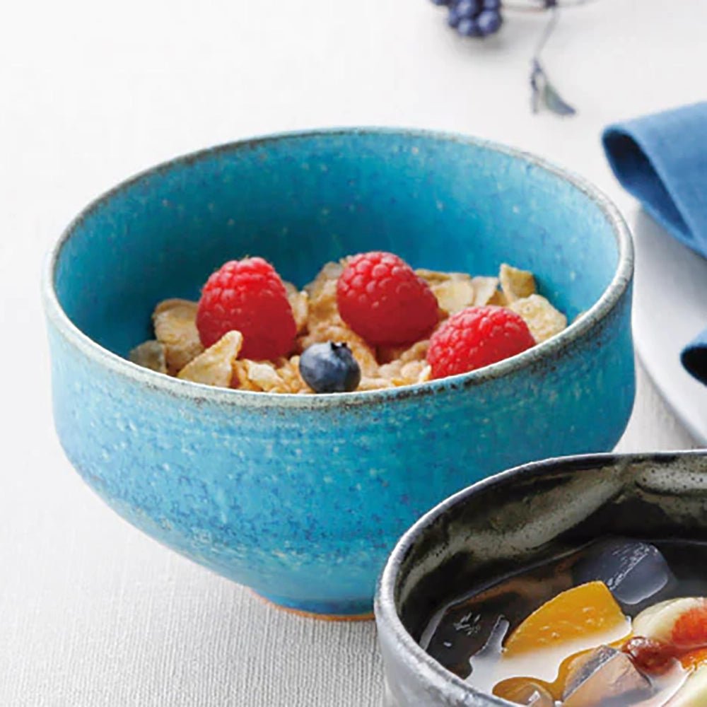 Shigaraki azure blue bowl used for serving cereal with berries, showcasing its vibrant glaze and everyday versatility.