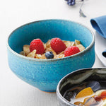 Shigaraki azure blue bowl used for serving cereal with berries, showcasing its vibrant glaze and everyday versatility.