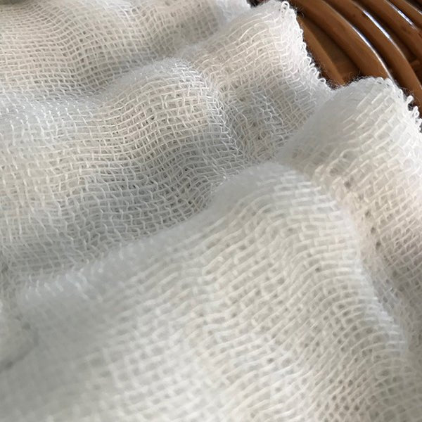 Close-up of Shirayuki Kitchen Cloth showing soft, layered gauze texture and fine open weave—designed for gentle, effective cleaning.