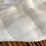 Detailed view of Shirayuki Kitchen Cloth showing its fine woven texture and gentle padding—made from layered Japanese gauze for softness and strength.