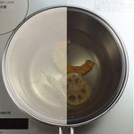 Splatter screen in use while frying tempura, showing clear visibility through the mesh
